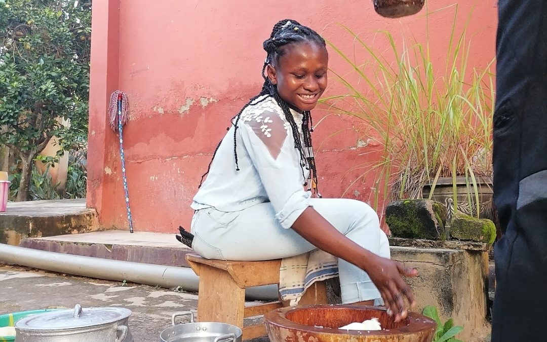 Comfort of team moon&star shows how to make fufu during traditional african cooking workshop
